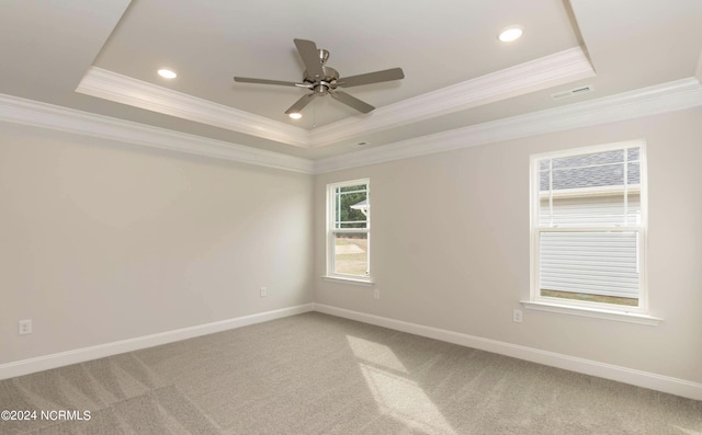 1225 Mandevilla Dr SE, Bolivia, NC 28422 - unfurnished room with a tray ceiling, ornamental molding, ceiling fan, baseboards, and light carpet