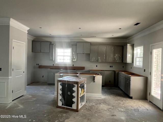 1225 Mandevilla Dr SE, Bolivia, NC 28422 - kitchen featuring ornamental molding, a center island, and gray cabinets