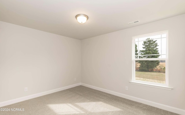 1225 Mandevilla Dr SE, Bolivia, NC 28422 - empty room with light colored carpet and baseboards