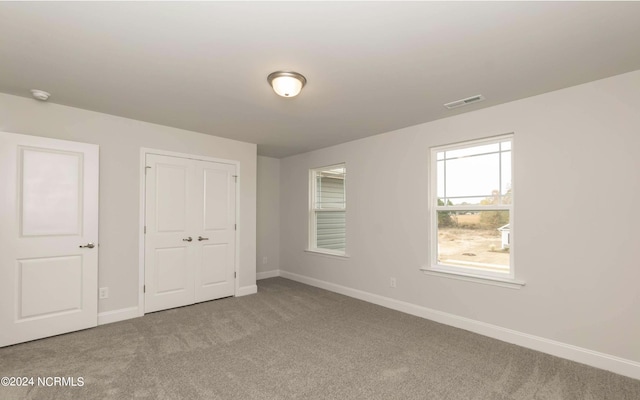 1225 Mandevilla Dr SE, Bolivia, NC 28422 - unfurnished bedroom with carpet flooring, baseboards, and a closet