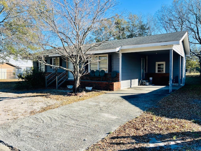 view of front of property featuring a carport