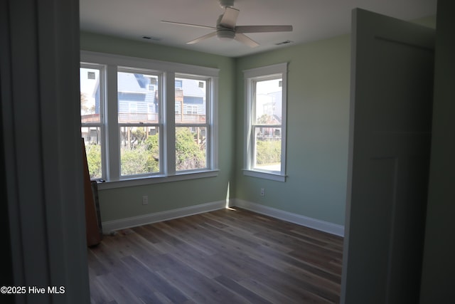 unfurnished room featuring a ceiling fan, baseboards, a healthy amount of sunlight, and visible vents