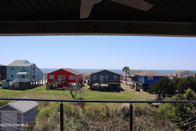 view of yard with a residential view and a balcony