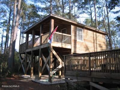 back of house featuring a wooden deck