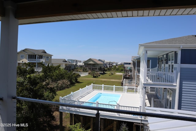 view of pool featuring a residential view, a fenced in pool, and fence