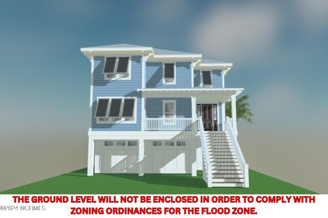 view of front of house with a garage, metal roof, and stairs