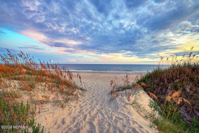property view of water featuring a beach view