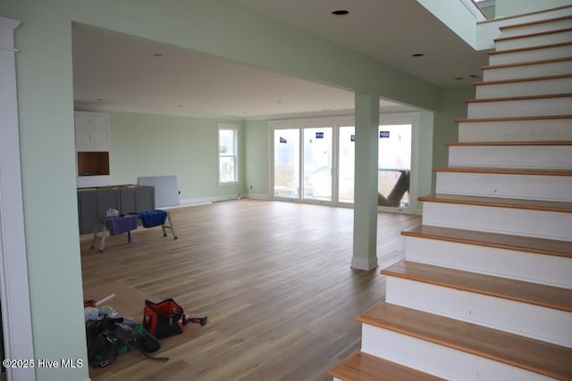 stairs featuring baseboards and wood finished floors