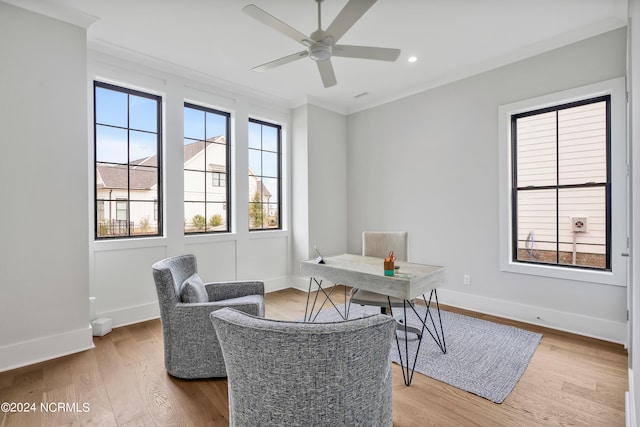 home office featuring ceiling fan, wood-type flooring, and ornamental molding