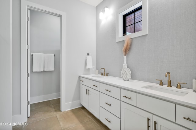 bathroom featuring tile patterned flooring and vanity