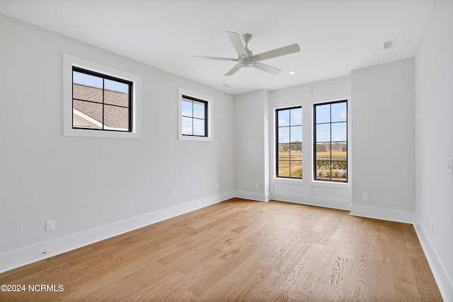 unfurnished room featuring ceiling fan and light hardwood / wood-style floors