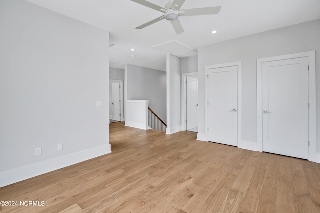 interior space with ceiling fan and light hardwood / wood-style floors