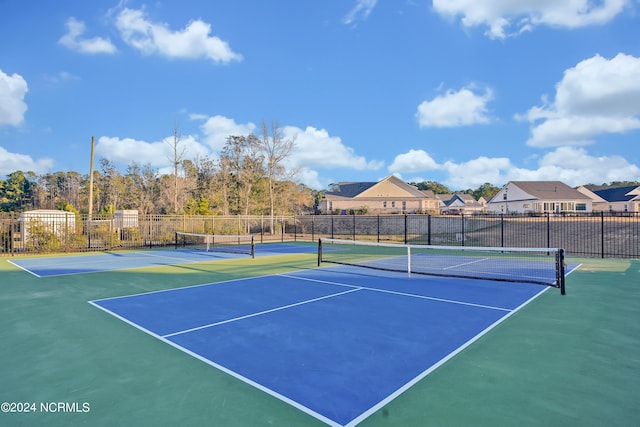 view of sport court featuring basketball hoop