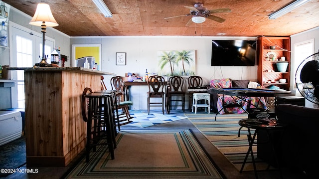 interior space with wooden ceiling and ceiling fan