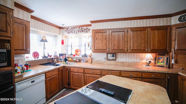 kitchen featuring hanging light fixtures, oven, and dishwasher