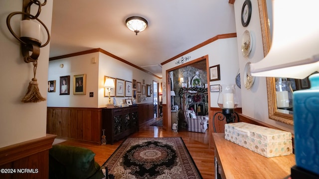 interior space with crown molding and light parquet flooring