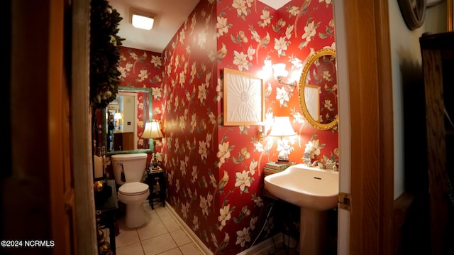 bathroom with toilet and tile flooring