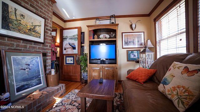 living room featuring brick wall, dark hardwood / wood-style flooring, and ornamental molding