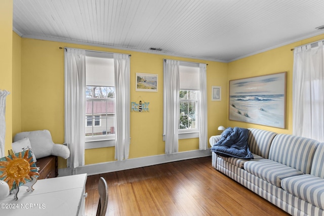 living room with crown molding and dark hardwood / wood-style flooring