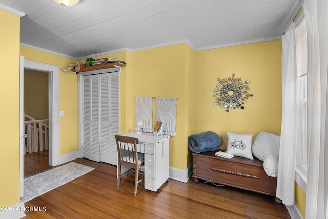 interior space with dark wood-type flooring and ornamental molding