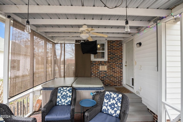 sunroom / solarium with ceiling fan, beamed ceiling, and wooden ceiling