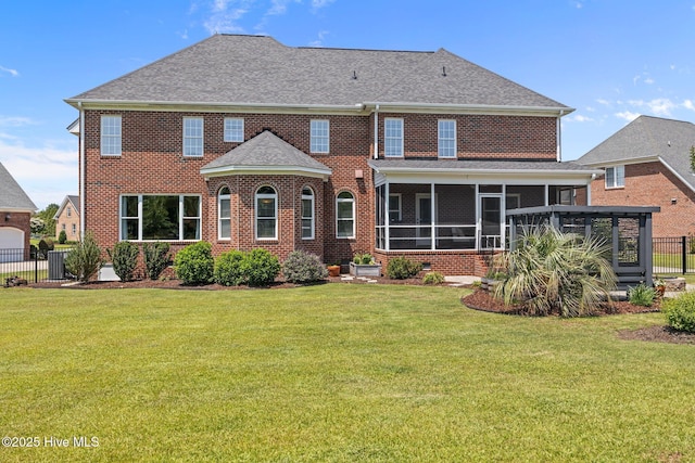 4441 Lagan Cir, Winterville, NC 28590 - back of house with a sunroom, brick siding, central AC unit, and roof with shingles