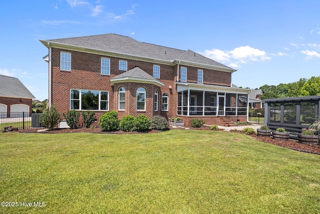 4441 Lagan Cir, Winterville, NC 28590 - back of house with a sunroom, brick siding, and a garage