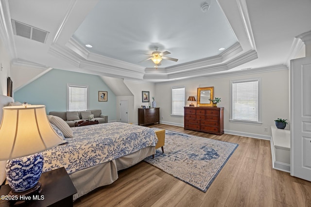 4441 Lagan Cir, Winterville, NC 28590 - bedroom with multiple windows, wood finished floors, ornamental molding, a tray ceiling, and a ceiling fan