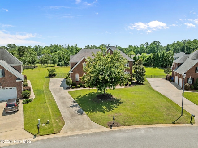 4441 Lagan Cir, Winterville, NC 28590 - view of front facade with driveway, a garage, and view of scattered trees