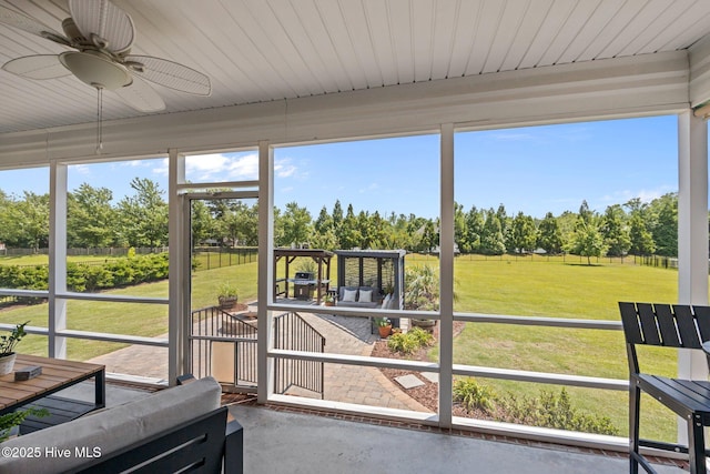 4441 Lagan Cir, Winterville, NC 28590 - sunroom / solarium featuring view of wooded area and a ceiling fan