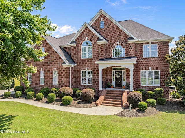 4441 Lagan Cir, Winterville, NC 28590 - colonial house with a front lawn and brick siding