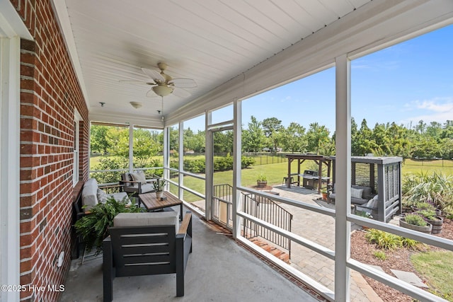 4441 Lagan Cir, Winterville, NC 28590 - sunroom with outdoor lounge area, a ceiling fan, and view of wooded area