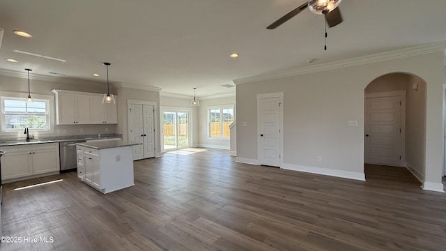 401 Bay Harbor Ct, Hubert, NC 28539 - kitchen featuring a sink, ornamental molding, arched walkways, stainless steel dishwasher, and a kitchen island