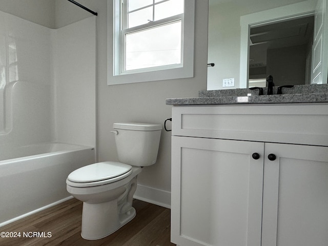 full bathroom featuring bathing tub / shower combination, vanity, toilet, and hardwood / wood-style floors