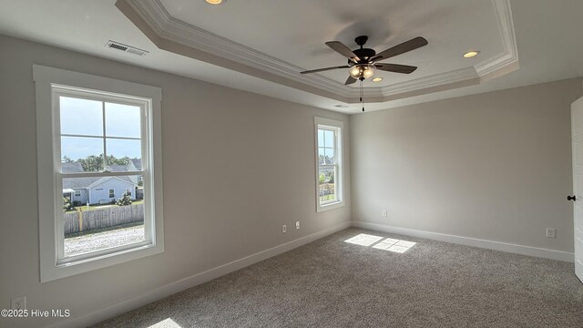 401 Bay Harbor Ct, Hubert, NC 28539 - empty room featuring a tray ceiling, ornamental molding, baseboards, and visible vents