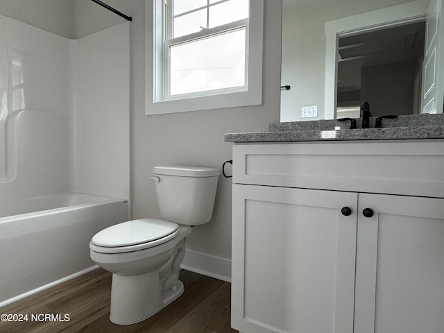 401 Bay Harbor Ct, Hubert, NC 28539 - bathroom featuring toilet, baseboards, vanity, bathtub / shower combination, and wood finished floors
