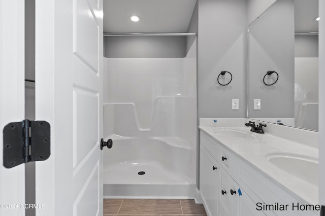 bathroom with tile patterned floors and double sink vanity