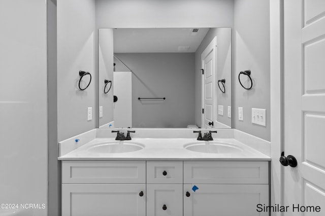 bathroom featuring double sink vanity