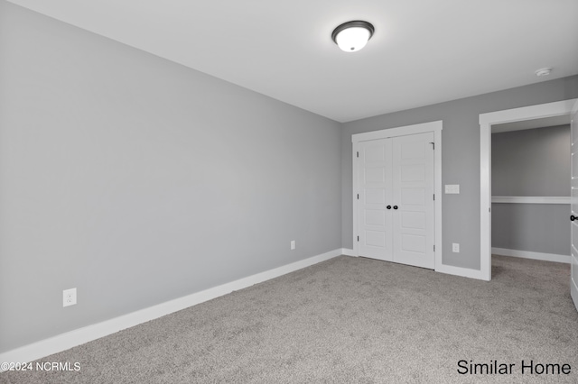 unfurnished bedroom featuring carpet