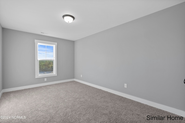 empty room featuring carpet flooring