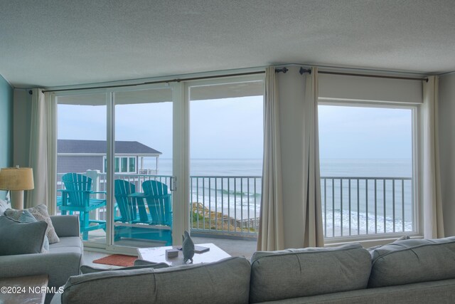 2000 New River Inlet Rd Unit 3309, North Topsail Beach, NC 28460 - living room with a water view and a textured ceiling