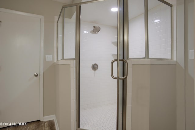 2000 New River Inlet Rd Unit 3309, North Topsail Beach, NC 28460 - bathroom with walk in shower and wood-type flooring