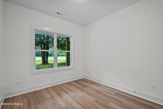 spare room with light hardwood / wood-style flooring