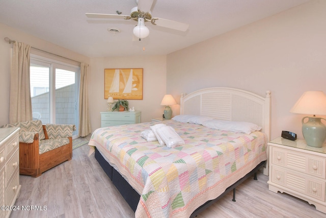 bedroom with light hardwood / wood-style floors and ceiling fan