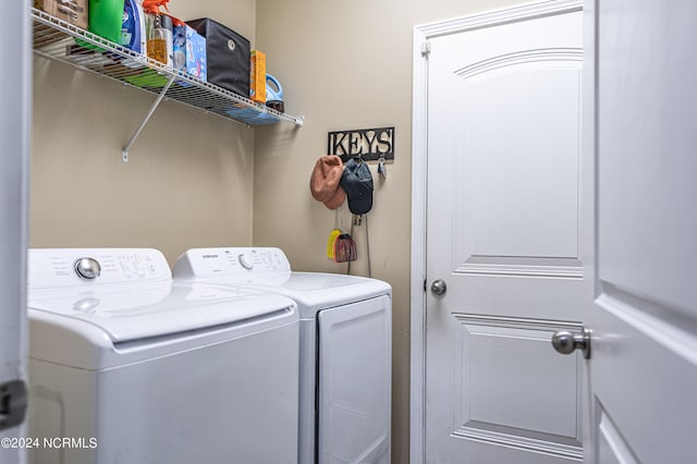 clothes washing area with independent washer and dryer