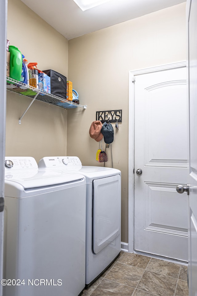 washroom with washer and dryer