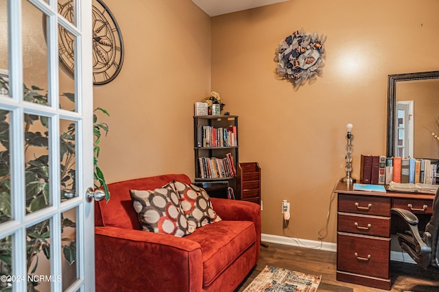 home office with dark hardwood / wood-style floors