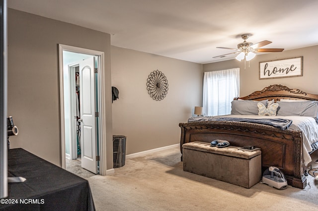 bedroom with light carpet and ceiling fan