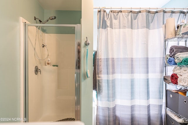 bathroom with a shower with shower curtain