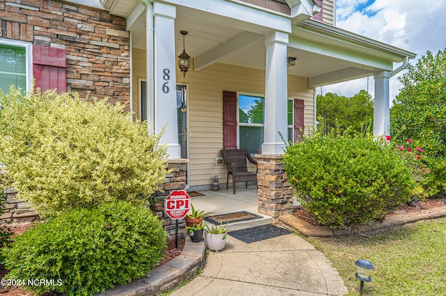 property entrance featuring a porch